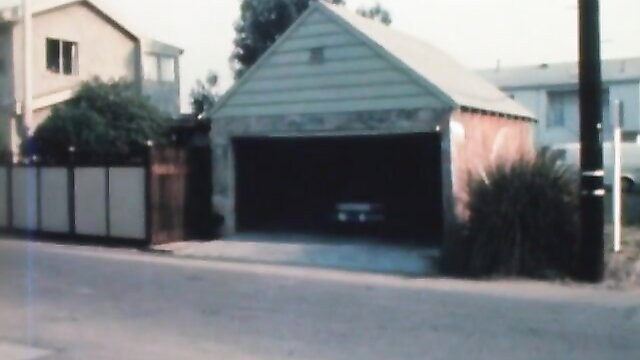 Vintage 1971 Johnny Wadd porn open garage exterior scene