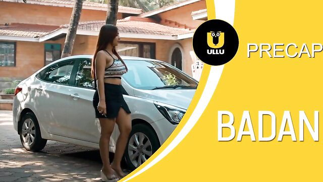 Hot Indian brunette in skimpy bralette and mini skirt poses sexy by white car