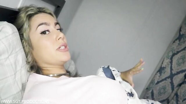 Blonde stepmom lounging seductively in bed on vacation