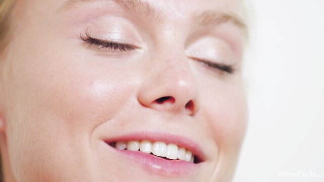 Nancy A smiling closeup, gorgeous Ukrainian model eyes closed