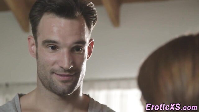 Handsome muscular man smiling close-up in erotic scene