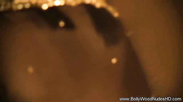 Indian sultry exotic temptress in golden glow tease