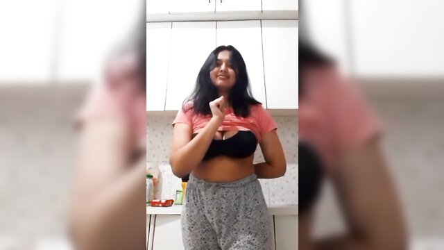 Indian girl flashing black bra cleavage in pink crop top and grey pants