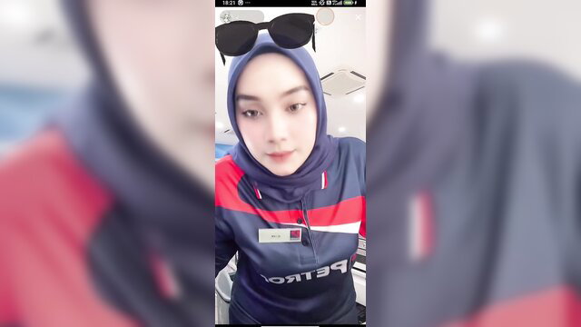 Malay Petron girl in hijab and tracksuit sunglasses selfie