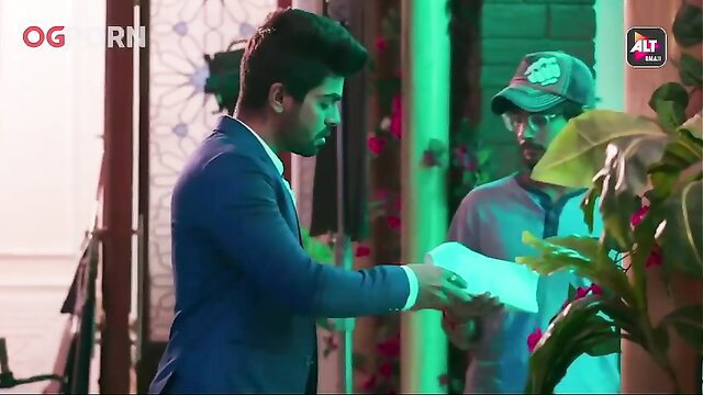 Handsome suited Indian man in suit hands paper in tense scene, ALT Balaji