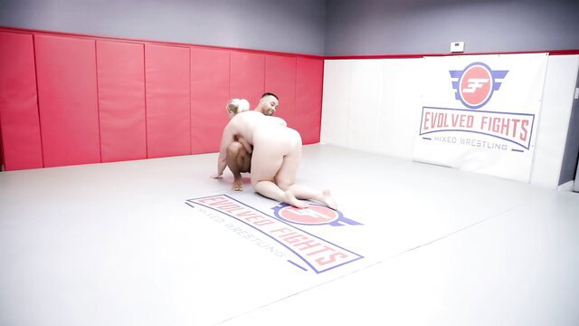 Lila Lovely vs Jaxson Briggs nude wrestling pin on Evolved Fights mat