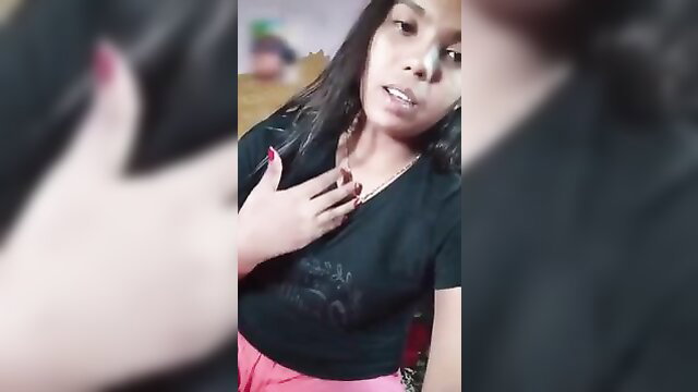 Sexy Asian girl in tight black top and pink shorts on video call