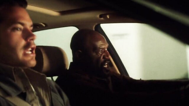 Muscular white guy and black man in tense car ride, intense gay thumbnail