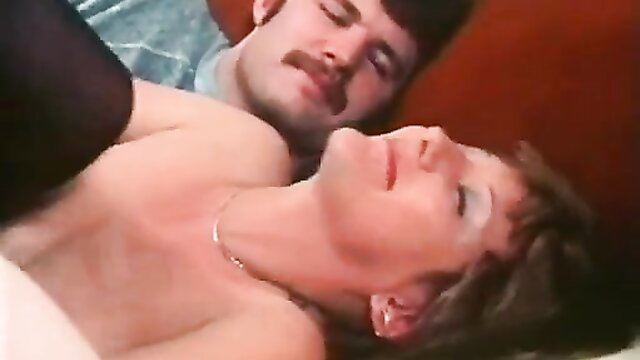 Vintage couple sex on bed, mustached guy with mature brunette woman