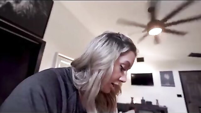 Blonde woman in robe loses her mojo in intimate bedroom closeup