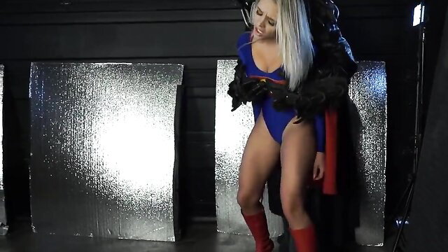 Blonde SuperiorGirl in tight Supergirl cosplay bodysuit, sexy pose