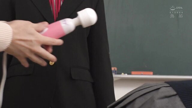 Suzu JAV teacher holds pink vibrator in classroom suit