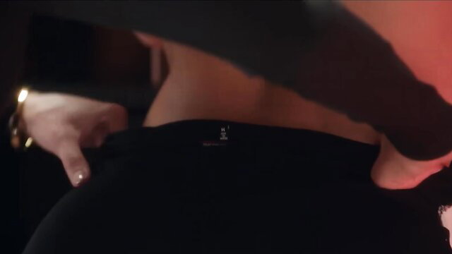 Hot brunette in tight black leggings teases with big ass from behind