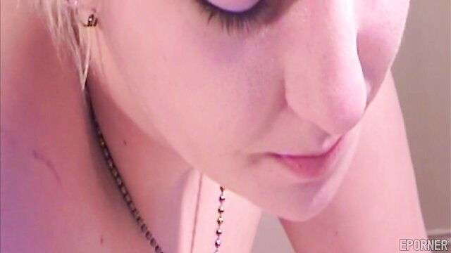 Closeup of hot blonde girl's teasing face and lips in adult video