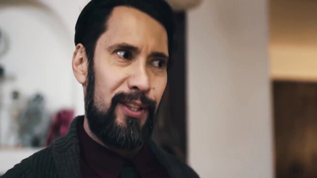 Osa Lovely seductive real estate agent in suit smirks closeup