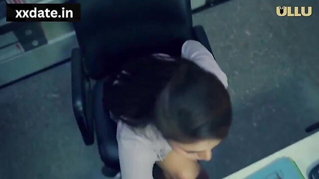 Indian office girl Neha sits in chair, top pulled down exposing tits