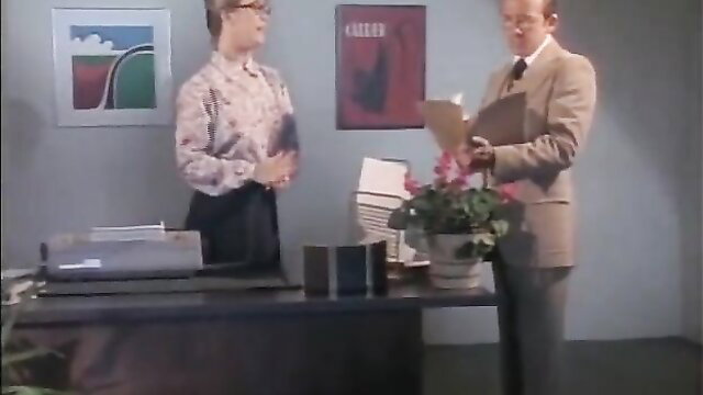 Marilyn Chambers in 70s office flirt with man, classic porn tease