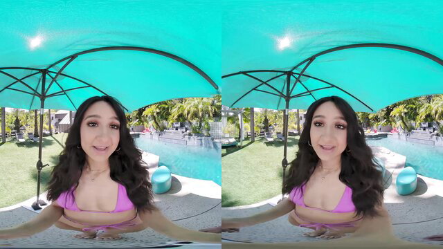Eliza Ibarra in pink bikini at pool, smiling for oiled VR blowjob