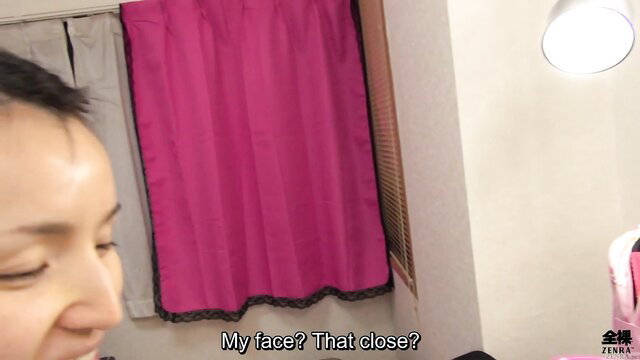 Closeup of frumpy Japanese housewife's face in Zenra makeover video