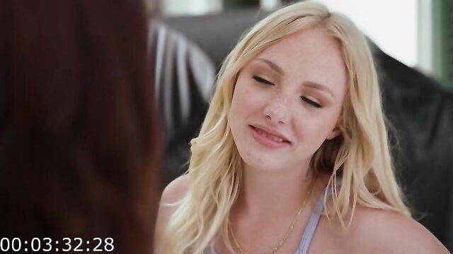 Blonde stepmom in light top smiles slyly at sneaky setup tease