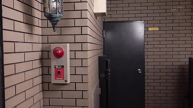 Japanese wife cheating scene in dim room with red alarm button