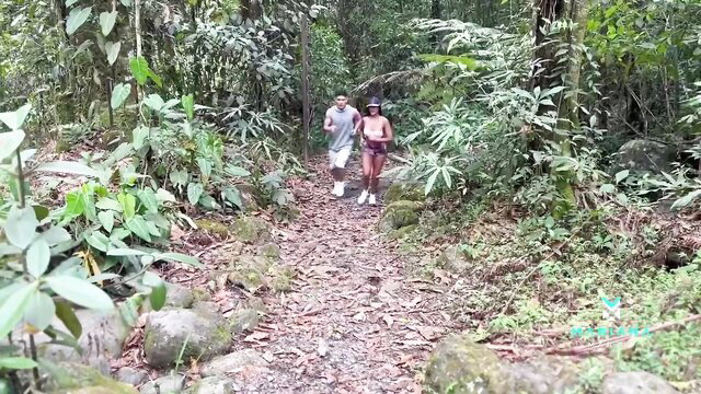 Mariana Martix runs topless in jungle trail with man on public hike