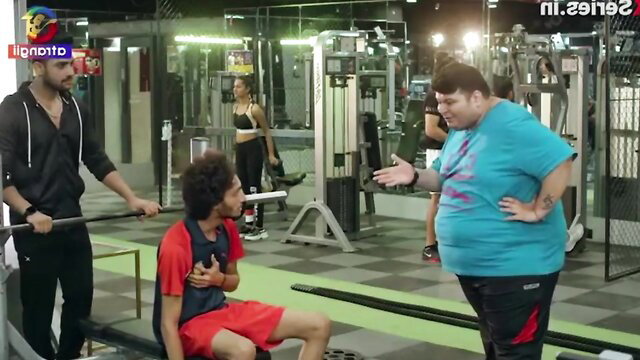 Indian gym bros chatting with fit women in tight workout gear