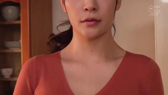 Mary Tachibana in tight red V-neck sweater, sexy closeup