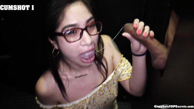Lucy Sunflower sucks BBC at gloryhole, cum dripping from mouth