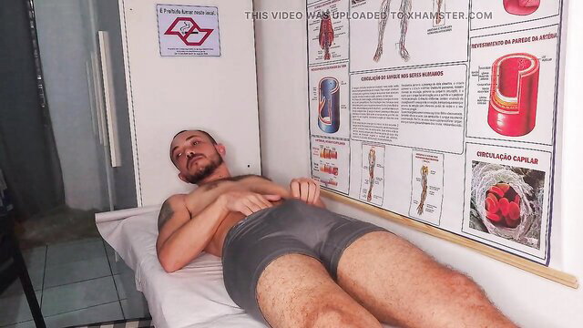 Hot Latino patient in gray briefs with bulge on exam bed