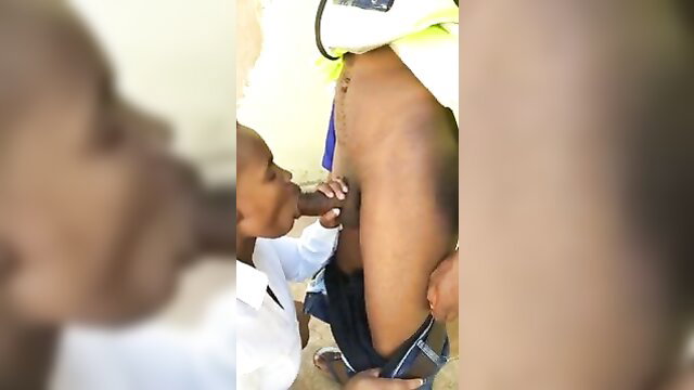 Black boy in school uniform sucking adult black man's cock closeup