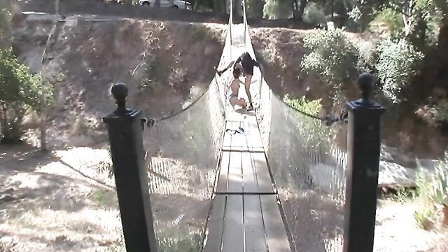 Woman on rope bridge in outdoor adventure tease, Gag Factor 22
