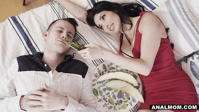 Clea Gaultier feeds annoyed stepson melon in red dress on bed
