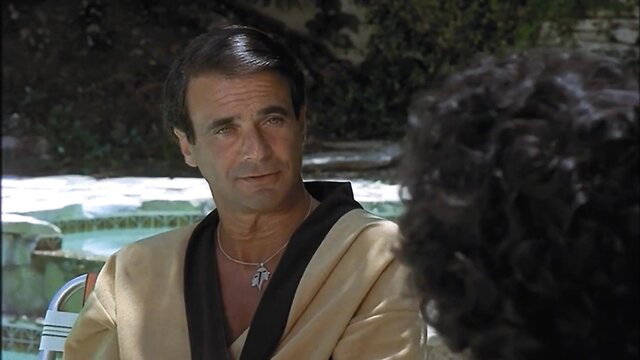 Handsome mature man in gold kimono robe by pool, classic erotic thumbnail