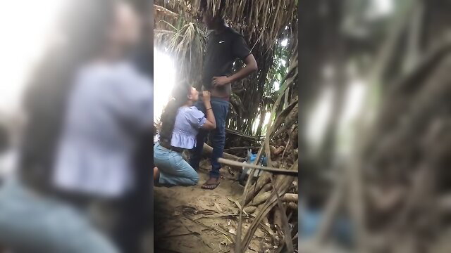 Amateur outdoor blowjob: Asian woman kneeling on black man in jungle hut