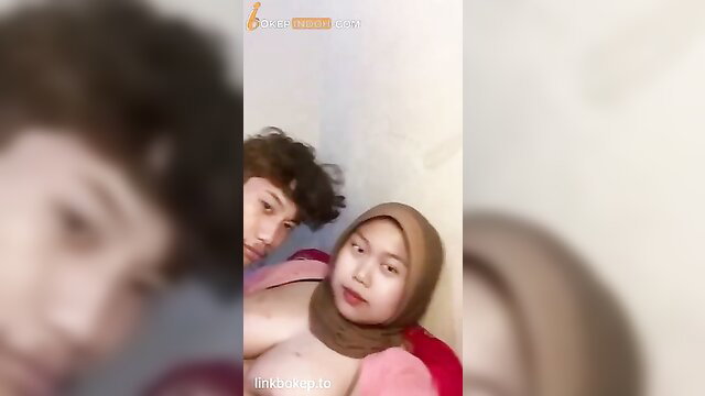 Indonesian hijab girl with chubby cheeks topless selfie with boyfriend