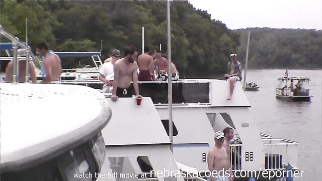 Nebraska Coeds partying on boat, shirtless guys drinking beer