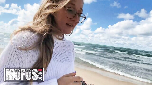 Molly Pills naked on sunny beach in white sweater, teasing outdoors