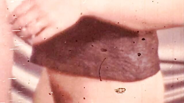 Retro porn slave in brown crotchless corset exposing pussy closeup