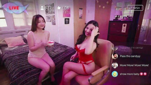 Two Filipina babes in lingerie teasing with candy on live cam