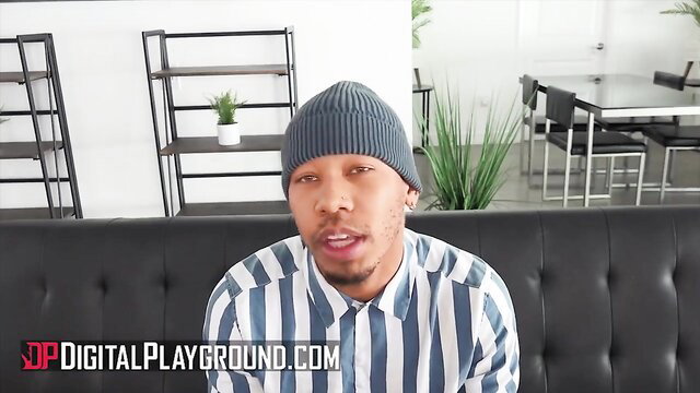 Ricky Johnson in striped shirt and beanie at Digital Playground