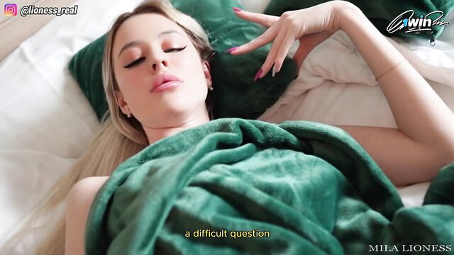 Mila Lioness blonde stepmom in bed, green blanket, seductive pose