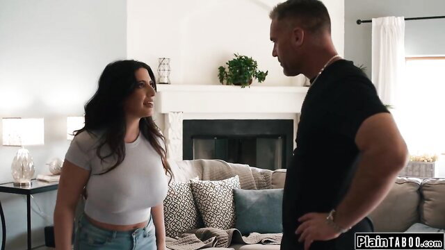 Brunette in sheer top talks to muscular man in living room Pure Taboo scene