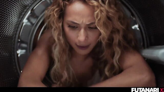 Curly haired babe stuck in washing machine, intense expression