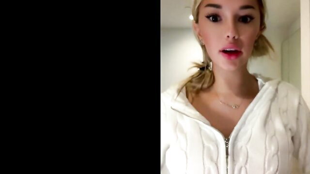 Breckie Hill in white hoodie, blonde ponytail, sexy pout lips