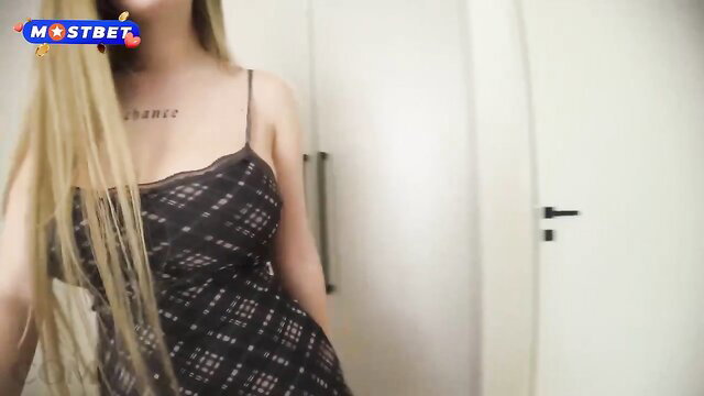 Blonde Comatozze in sexy black lace dress, teasing solo