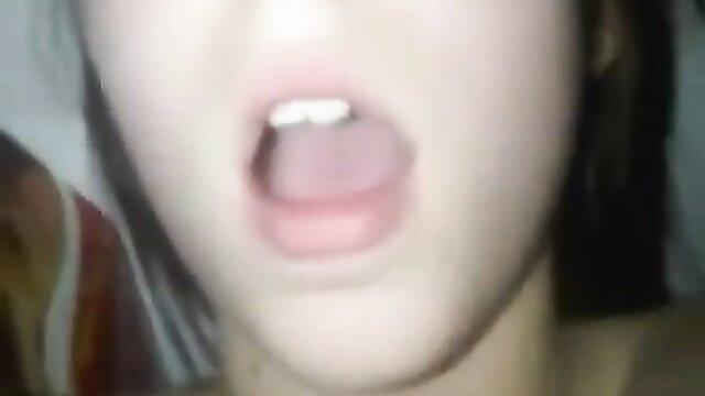 Young brunette opens mouth wide in sensual closeup preview