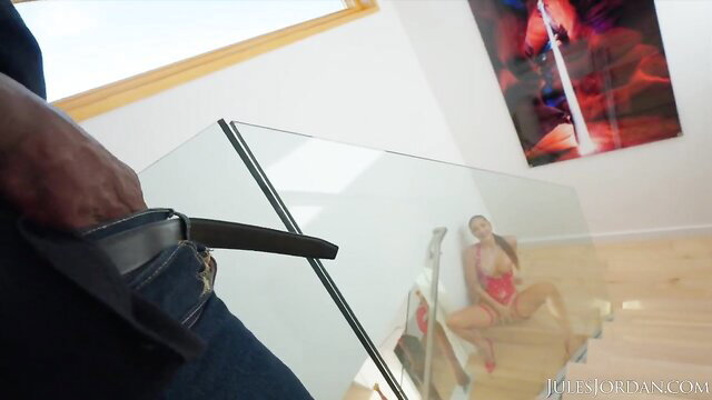 Gizelle Blanco in red lingerie by glass railing, Jules Jordan