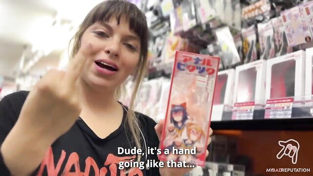 MyBadReputation flips off in Tokyo sex shop holding JAV toy box