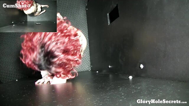 Redhead camgirl with huge tits bends over at gloryhole, ready for brute breeding